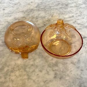 Two depression pink glass 5 inch bowls with leaves.